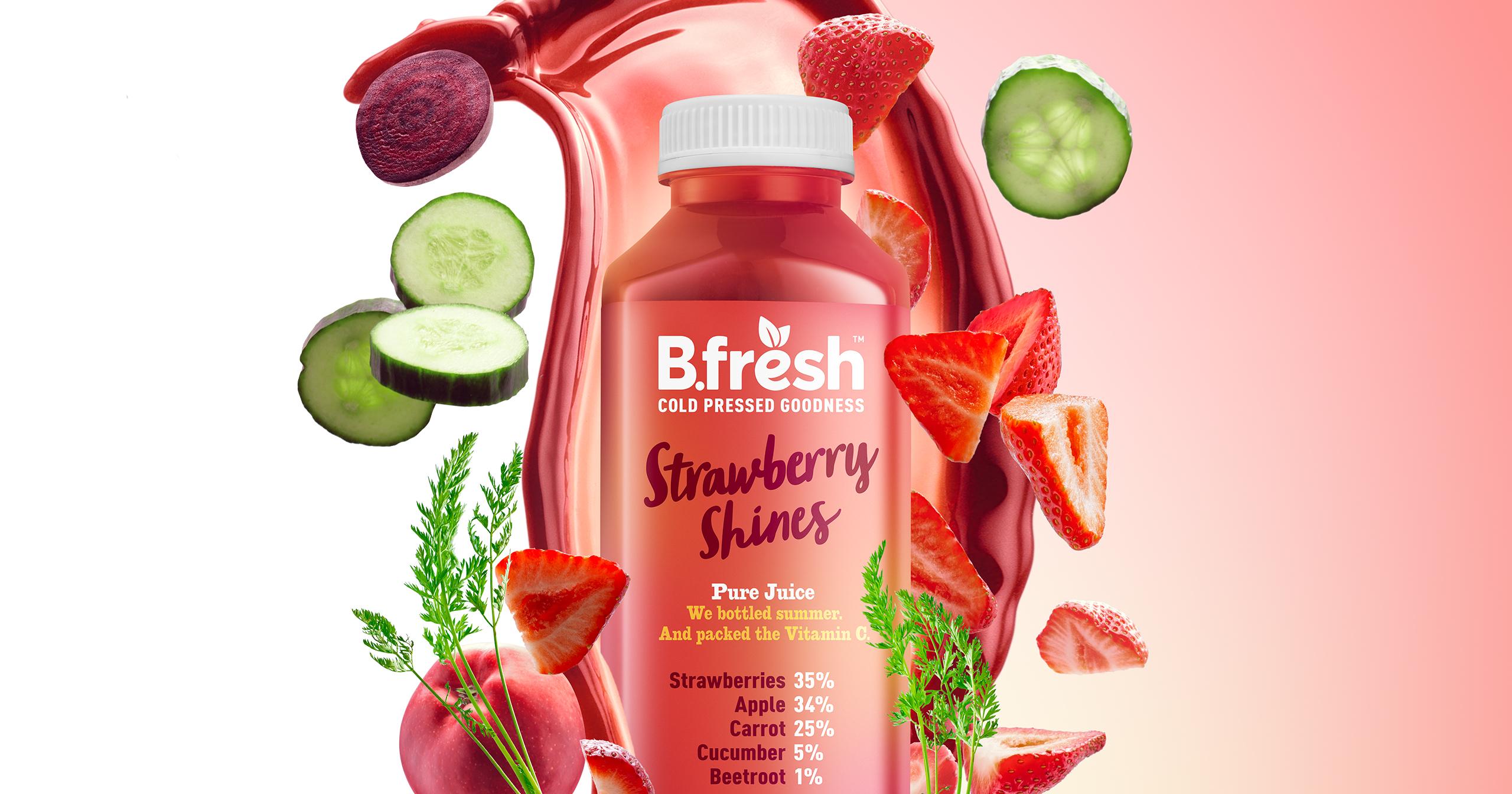 Strawberry juice bottle surrounded by dynamic juice splashes - creative retouching and post-production